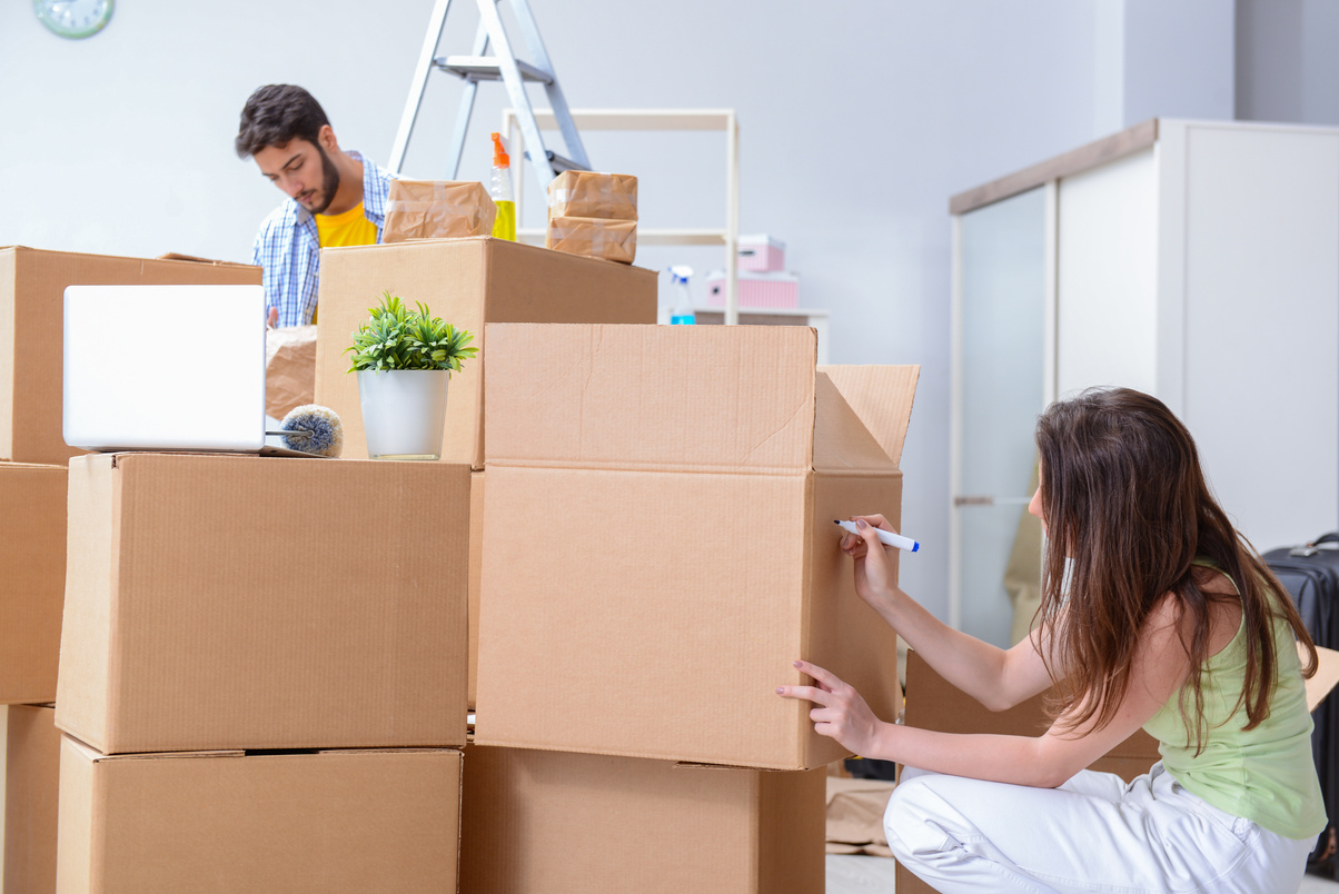 Young Family Unpacking at New House 